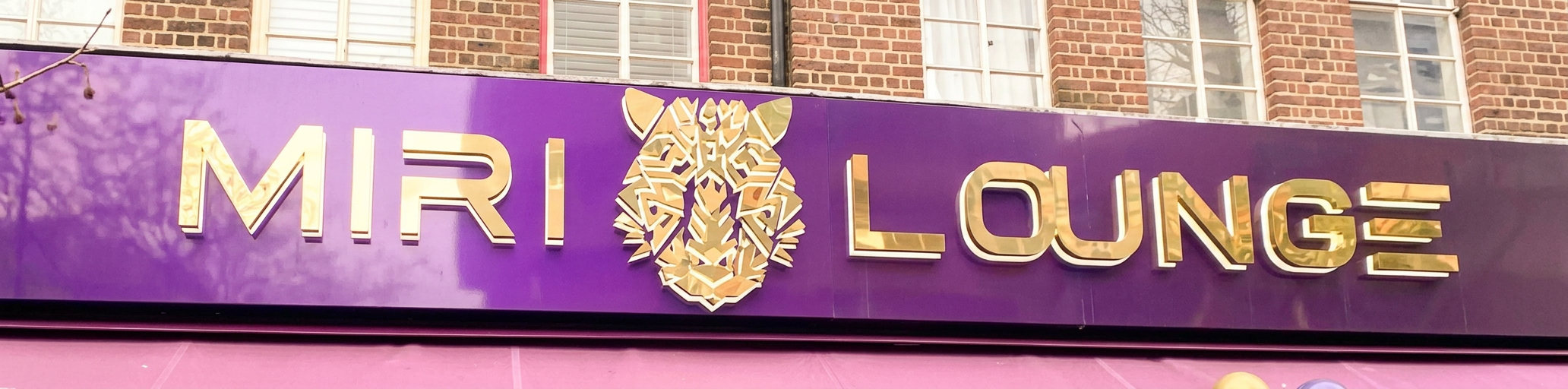 The Miri Lounge sign on New Broadway